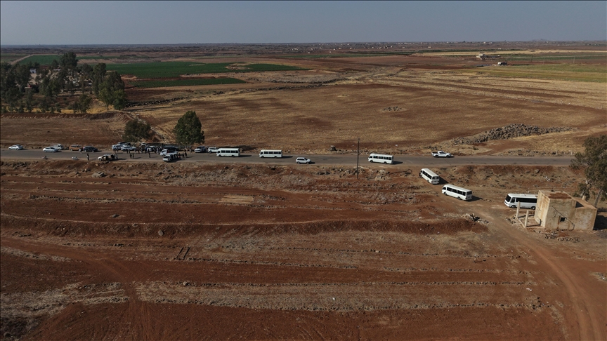 An aerial view of the convoy of buses carrying civilians, being evacuated by Syrian authorities from Suwayda province to Daraa as of Wednesday, according to the state-run SANA news agency, on July 23, 2025.